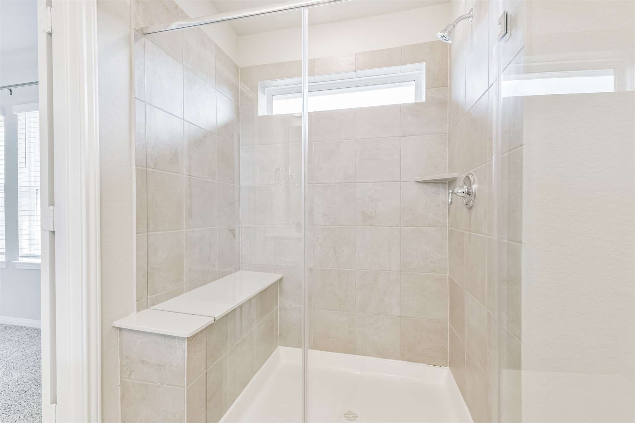 17465 Buckeye Branch Conroe, TX 77385 - Photo 23 of 47 The Primary bathroom features a spacious layout with a large walk-in shower and ample natural light.