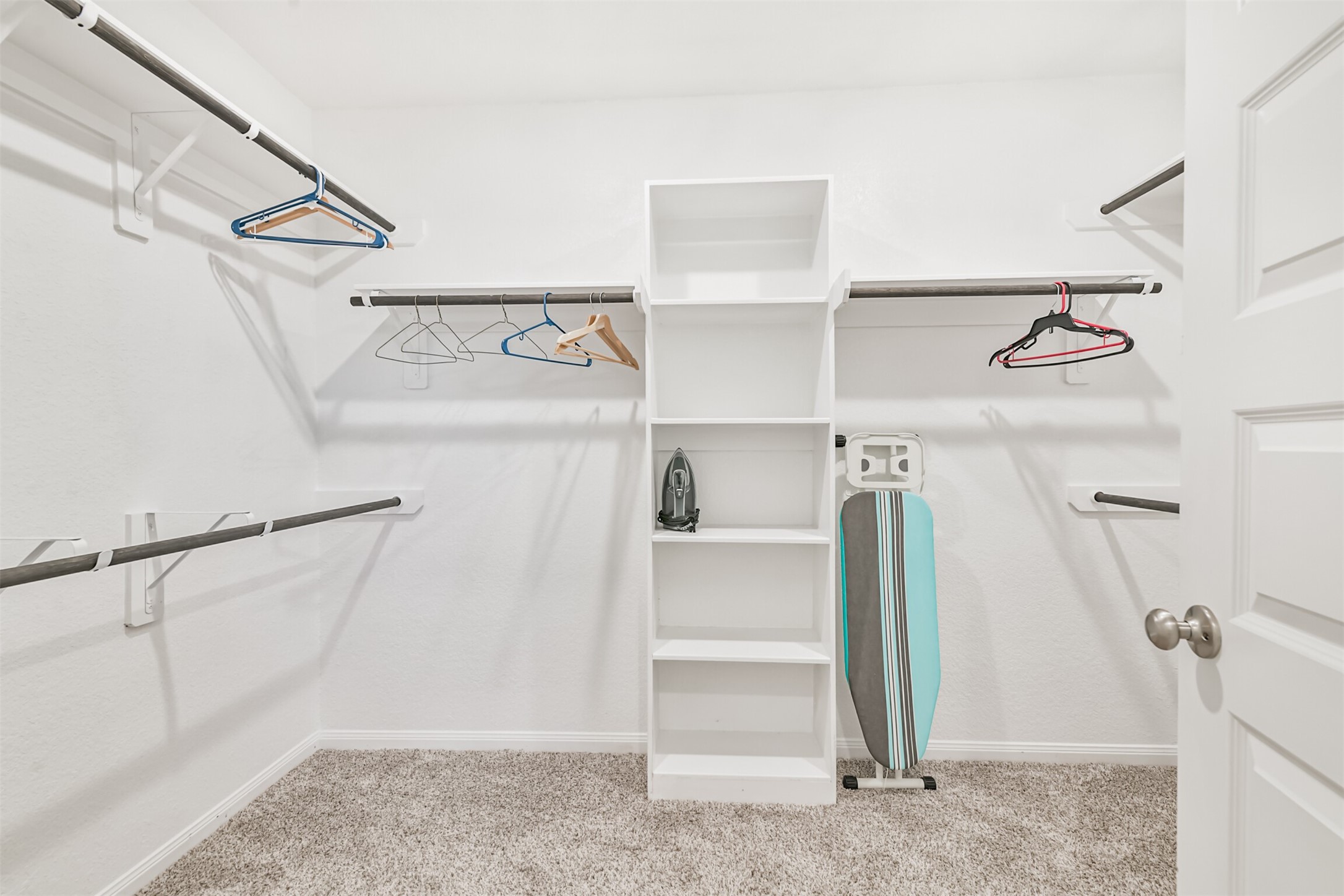 17465 Buckeye Branch Conroe, TX 77385 - Photo 24 of 47 Primary walk in closet has built in shelves and plenty of storage