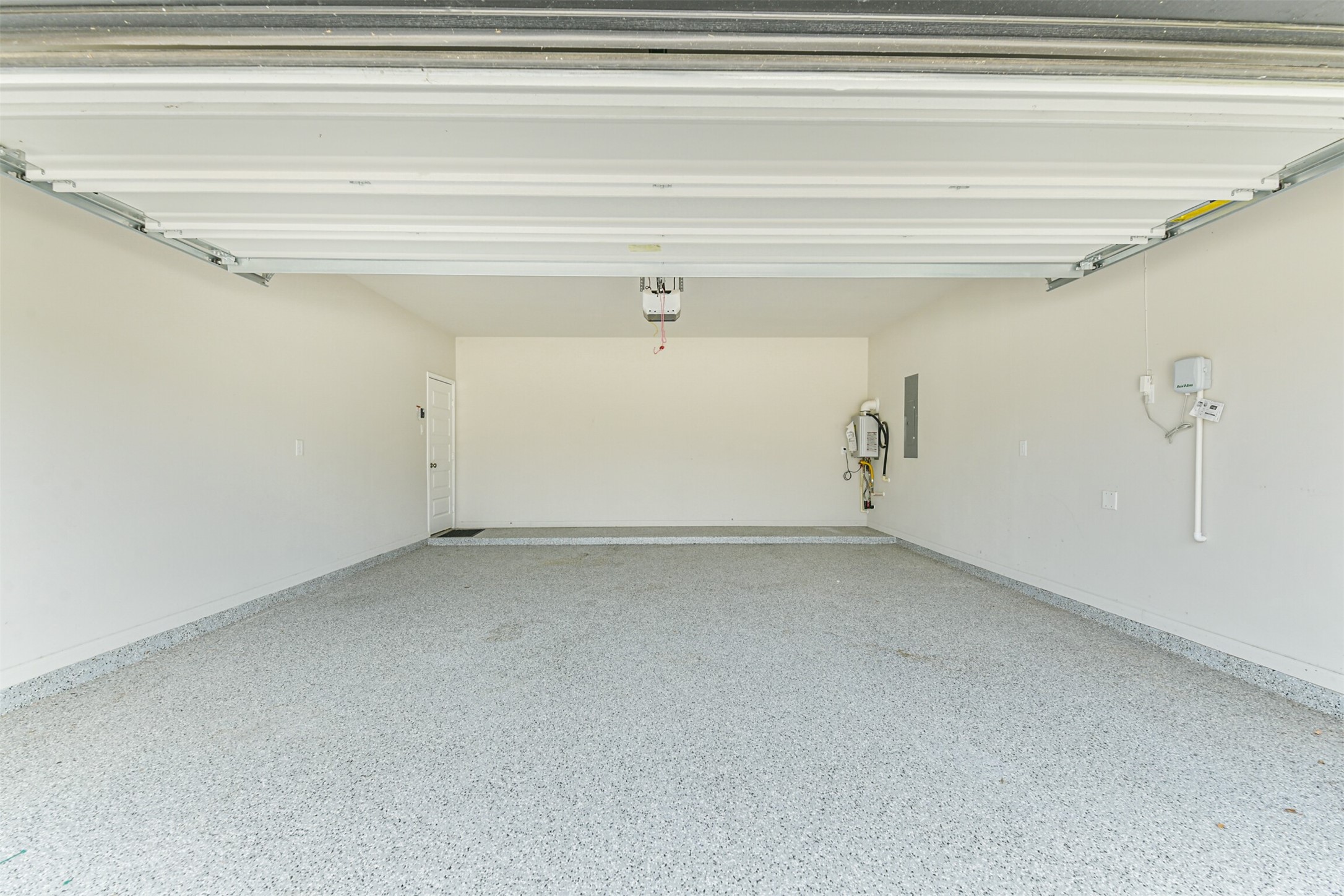 17465 Buckeye Branch Conroe, TX 77385 - Photo 37 of 47 Garage with Epoxy Flooring