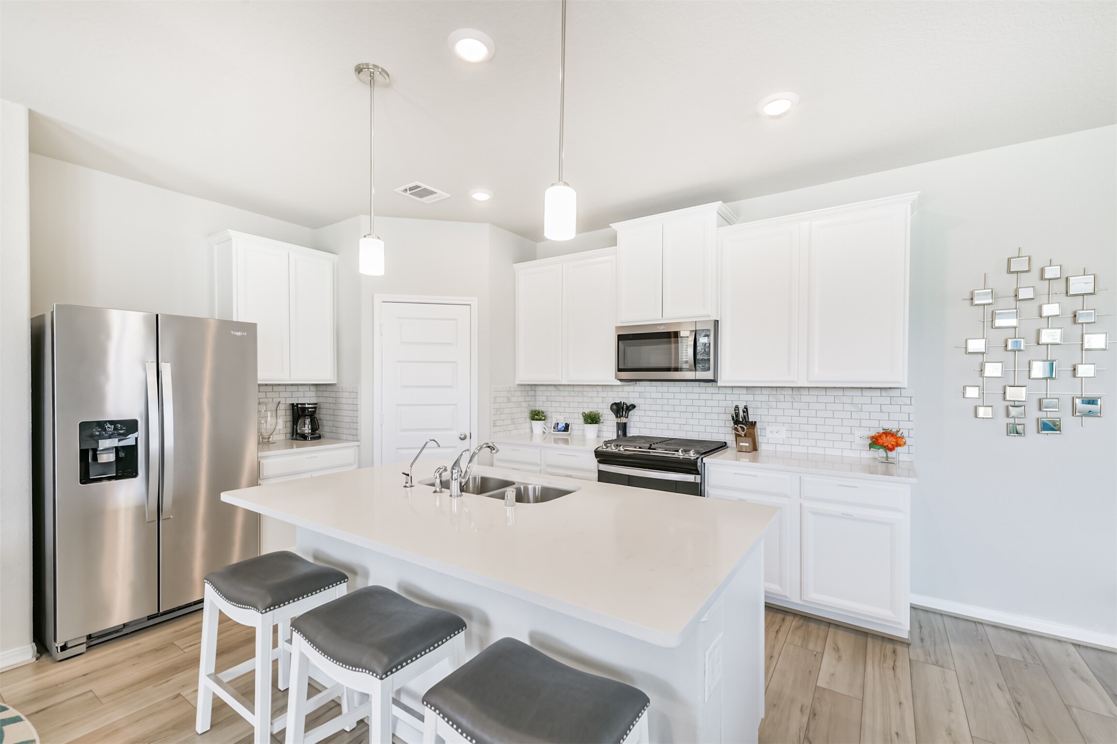 17465 Buckeye Branch Conroe, TX 77385 - Photo 8 of 47 This spacious open-concept living area features modern design with, and a stylish kitchen with a breakfast bar. Perfect for entertaining and family gatherings.