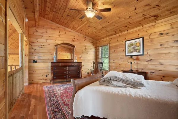 a bedroom with a bed and a dresser