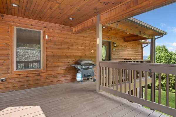 an aerial view of a house with a garden and swimming pool