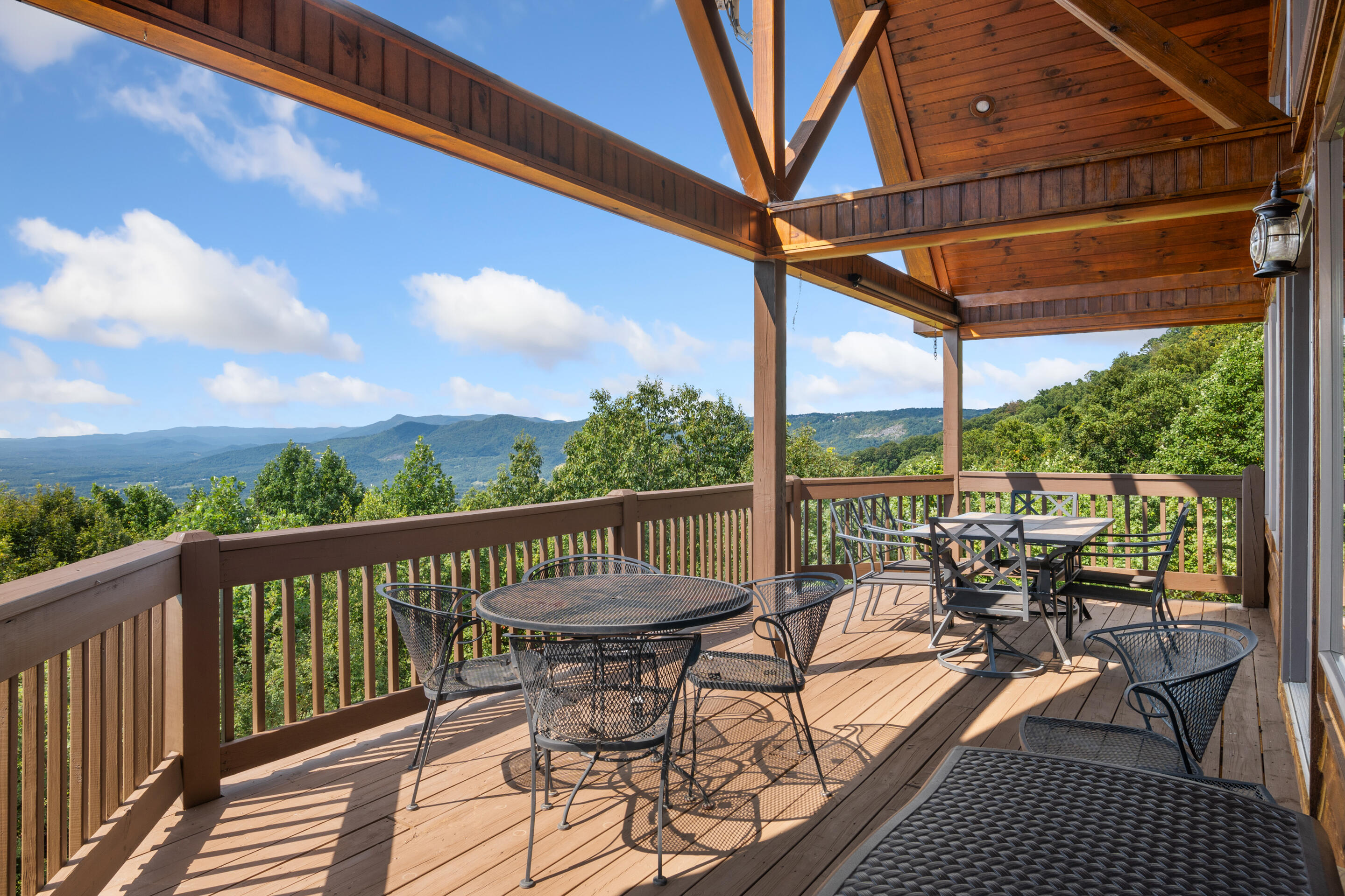 316 Reflections Pt Trail Fancy Gap, VA 24328 - Photo 54 of 78 a view of a balcony with chairs and iron fence
