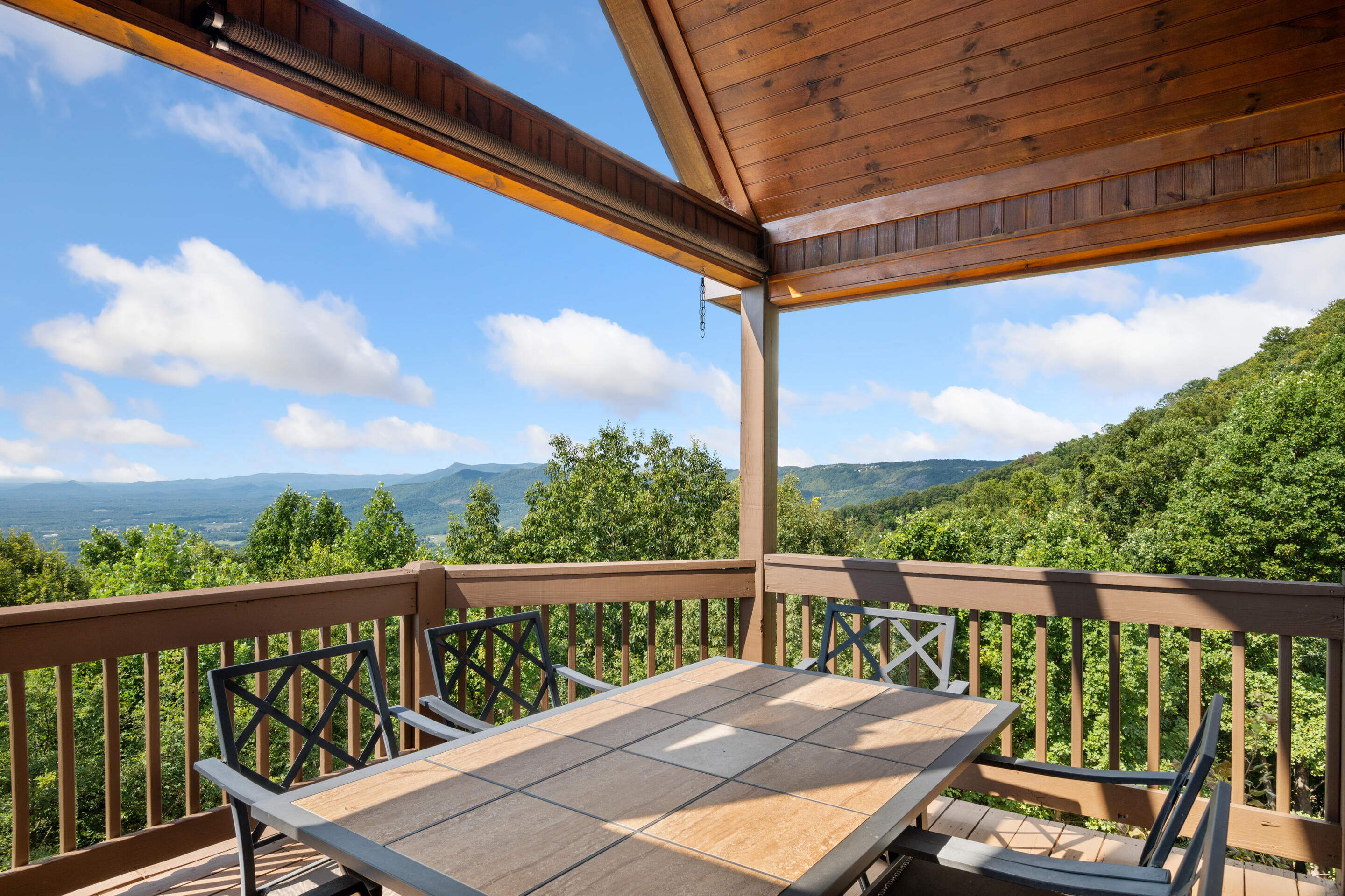 316 Reflections Pt Trail Fancy Gap, VA 24328 - Photo 56 of 78 a view of a balcony with wooden floor and outdoor seating