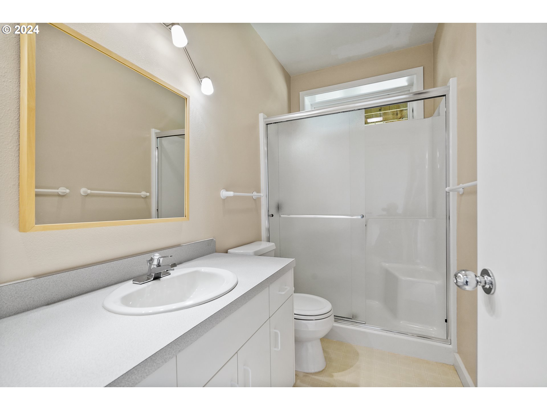 6815 Northwest Concord Drive Corvallis, OR 97330 - Photo 35 of 48 a bathroom with a sink toilet a mirror and shower