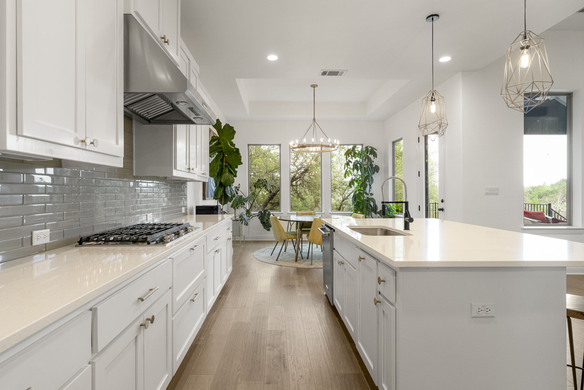 288 Hazy Hills Loop Dripping Springs, TX 78620 - Photo 16 of 40 The kitchen opens effortlessly into the living and dining areas, creating a functional, connected layout.