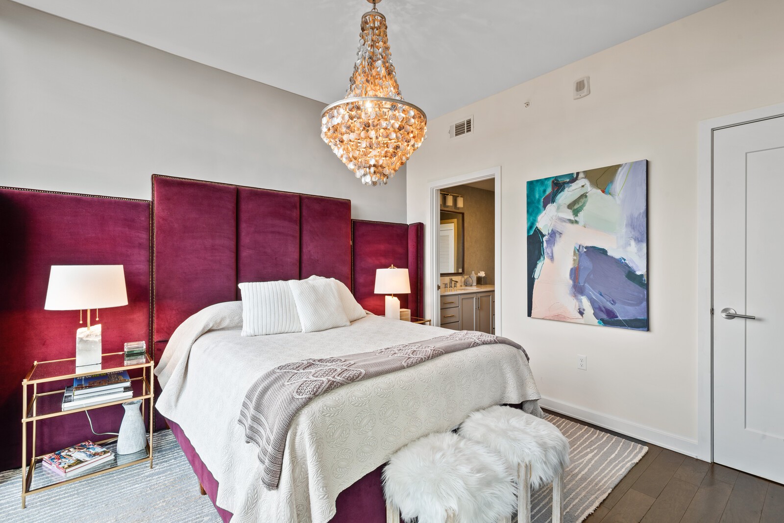 1212 Laurel Street, Unit 1815 Nashville, TN 37203 - Photo 14 of 26 a bed room with a bed and a chandelier