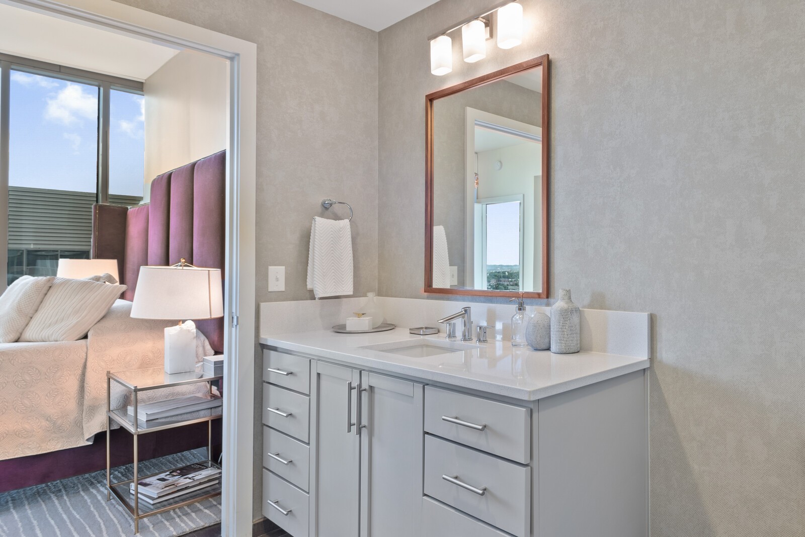 1212 Laurel Street, Unit 1815 Nashville, TN 37203 - Photo 17 of 26 a bathroom with a sink vanity and mirror