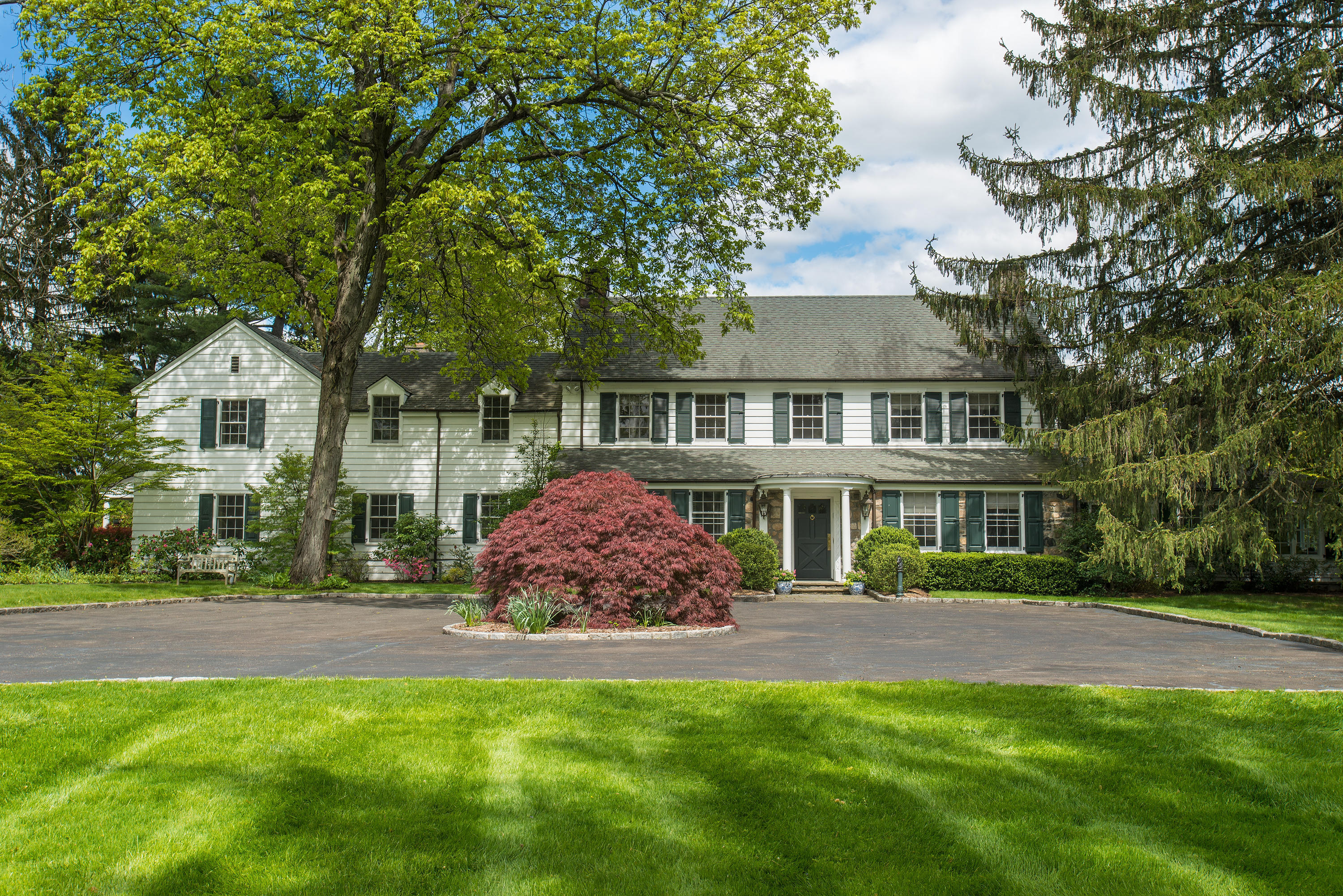 470 Taconic Road Greenwich, CT 06831 - Photo 1 of 1 a front view of a house with a yard