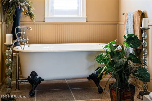 a bathroom with a sink vanity and a mirror