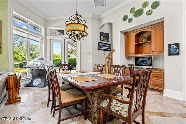 an aerial view of residential houses with outdoor space and swimming pool