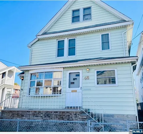 a front view of a house with glass windows
