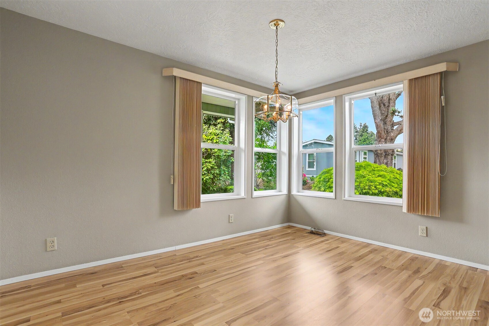905 243rd Street Southwest Bothell, WA 98021 - Photo 15 of 37 a view of empty room with wooden floor and fan