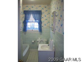374 Battlefield Road Waynesboro, VA 22980 - Photo 7 of 12 a bathroom with a sink a toilet and mirror
