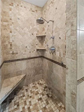 a view of a livingroom with entryway stairs and a living room