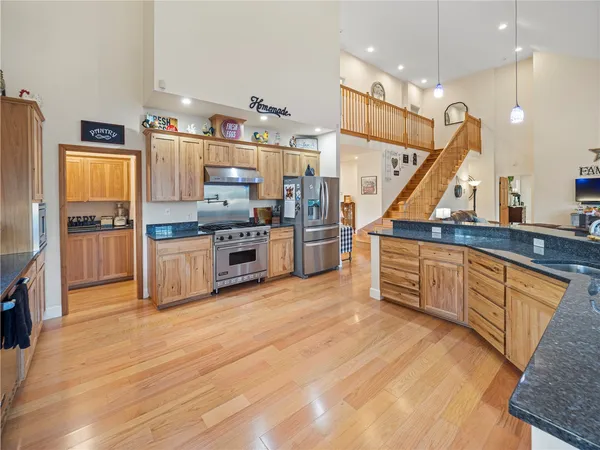 a kitchen with a window a sink and a cabinets