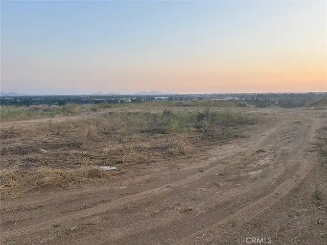 a view of a field with an ocean