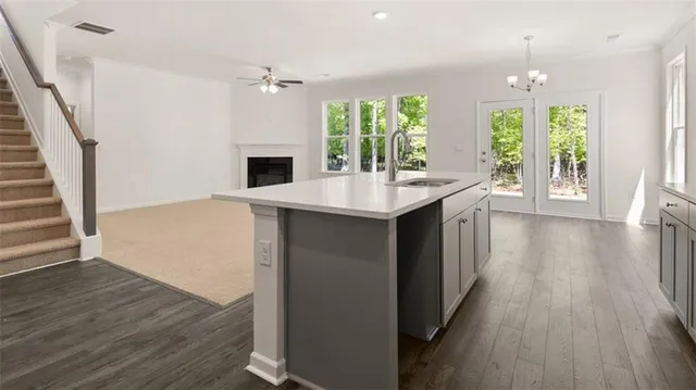 wooden floor in an empty room with a window and wooden floor
