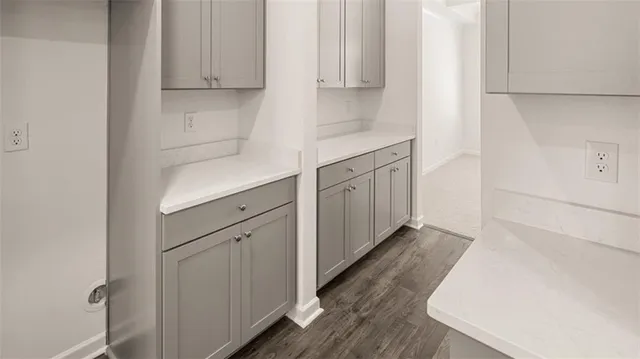 a kitchen with white cabinets