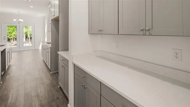 a view of a kitchen with electric appliances