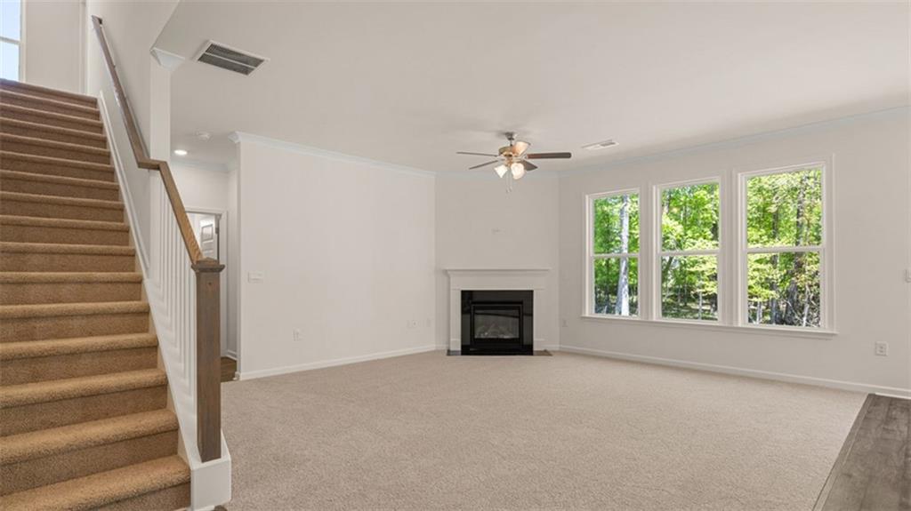 13586 Whitman Lane Covington, GA 30014 - Photo 24 of 50 a view of an empty room with fireplace and a window