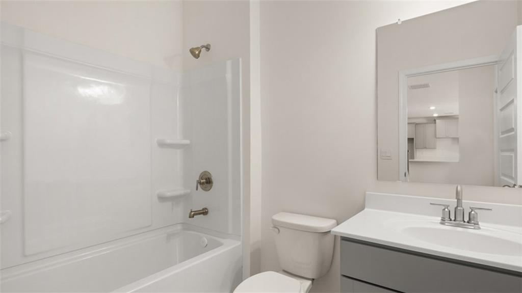 13586 Whitman Lane Covington, GA 30014 - Photo 30 of 50 a bathroom with a sink a toilet and shower