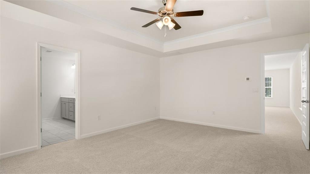 13586 Whitman Lane Covington, GA 30014 - Photo 33 of 50 a view of a livingroom with a ceiling fan and entryway