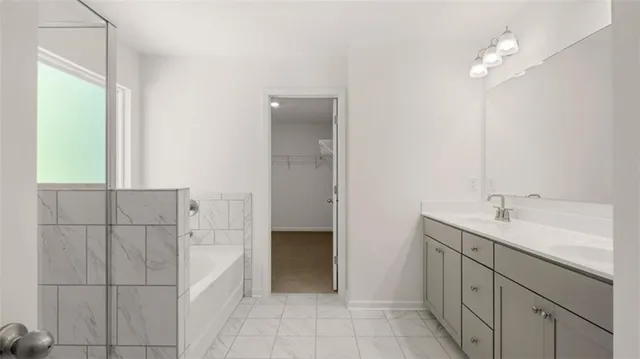 a white bath tub sitting next to a window