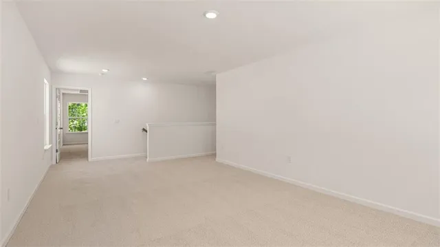 a room with refrigerator and mirror