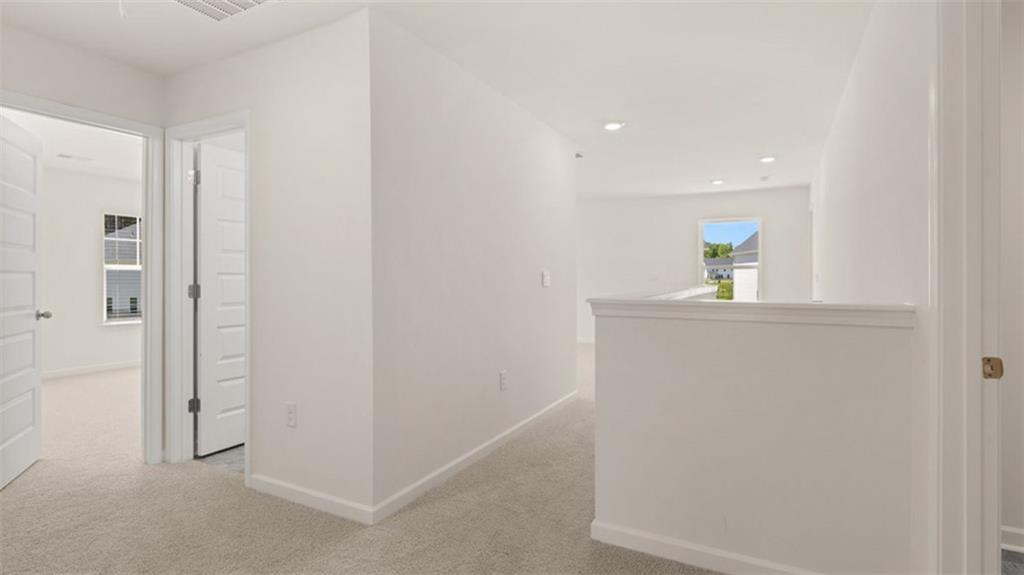 13586 Whitman Lane Covington, GA 30014 - Photo 42 of 50 a room with refrigerator and mirror