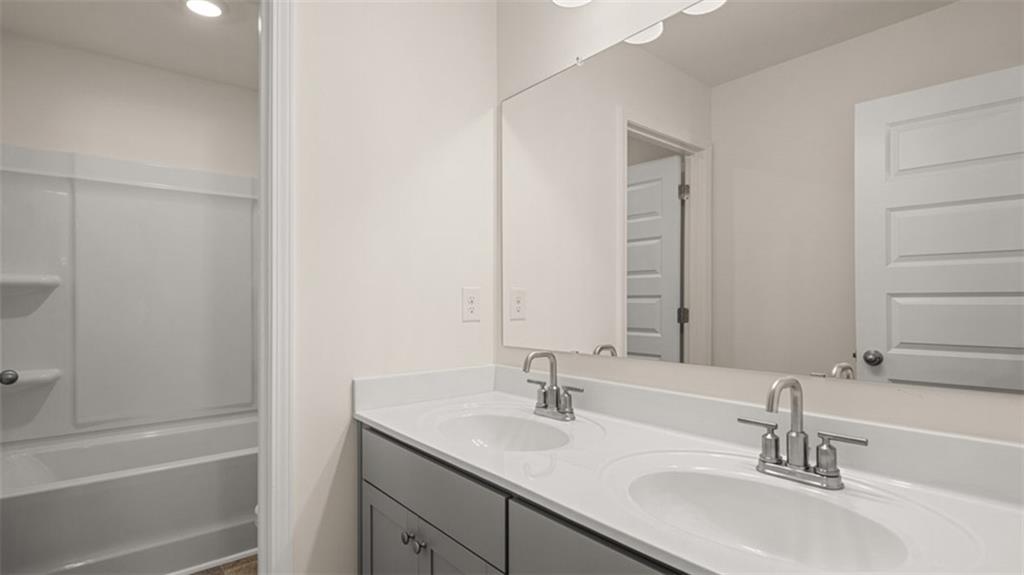 13586 Whitman Lane Covington, GA 30014 - Photo 47 of 50 a bathroom with a sink and a mirror