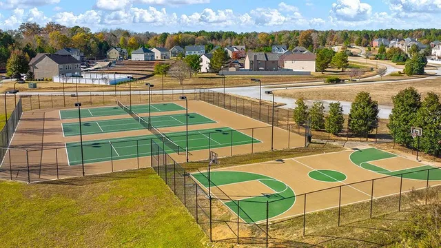 a view of a swimming pool with an outdoor seating