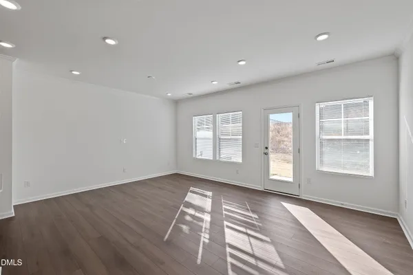 a view of kitchen with wooden floor and electronic appliances