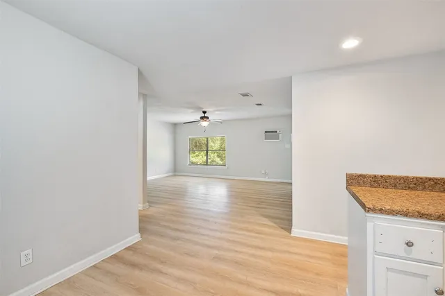 a view of an empty room and window