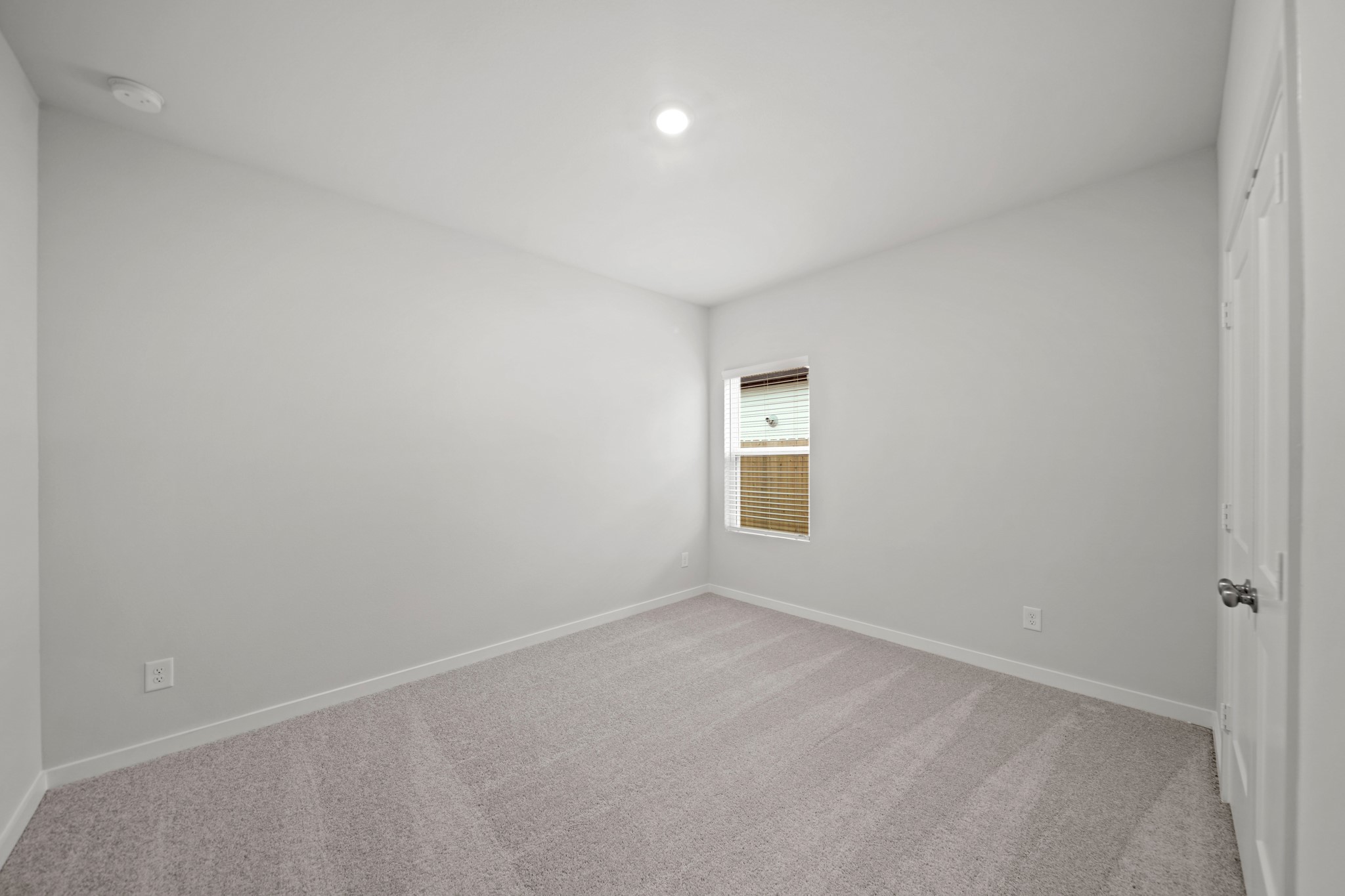 522 Tawny Rim Drive Willis, TX 77318 - Photo 11 of 27 an empty room with a window