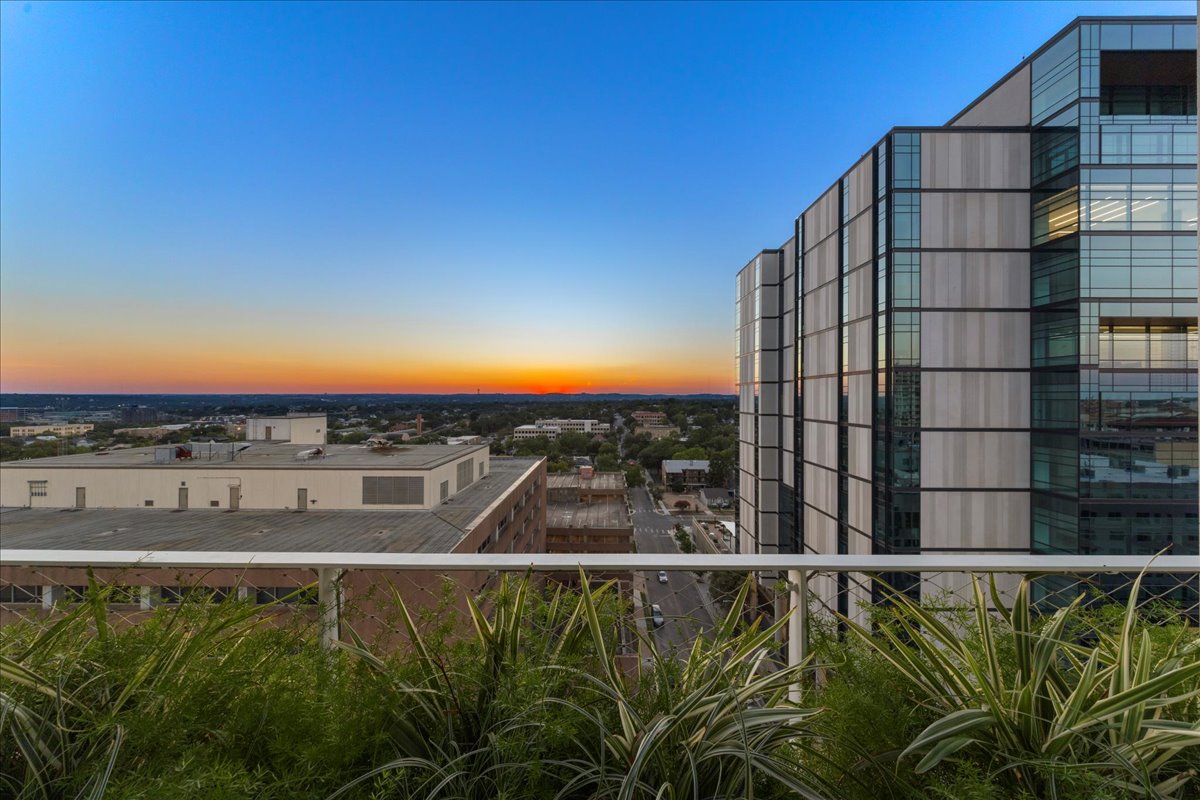 313 West 17th Street, Unit 1104 Austin, TX 78701 - Photo 18 of 40 A serene terrace framed by planters installed by Lattice Studio, offering unobstructed views of the Texas Hill Country and year-round sunsets. An ideal setting for morning coffee, evening cocktails or quiet moments overlooking the city skyline.