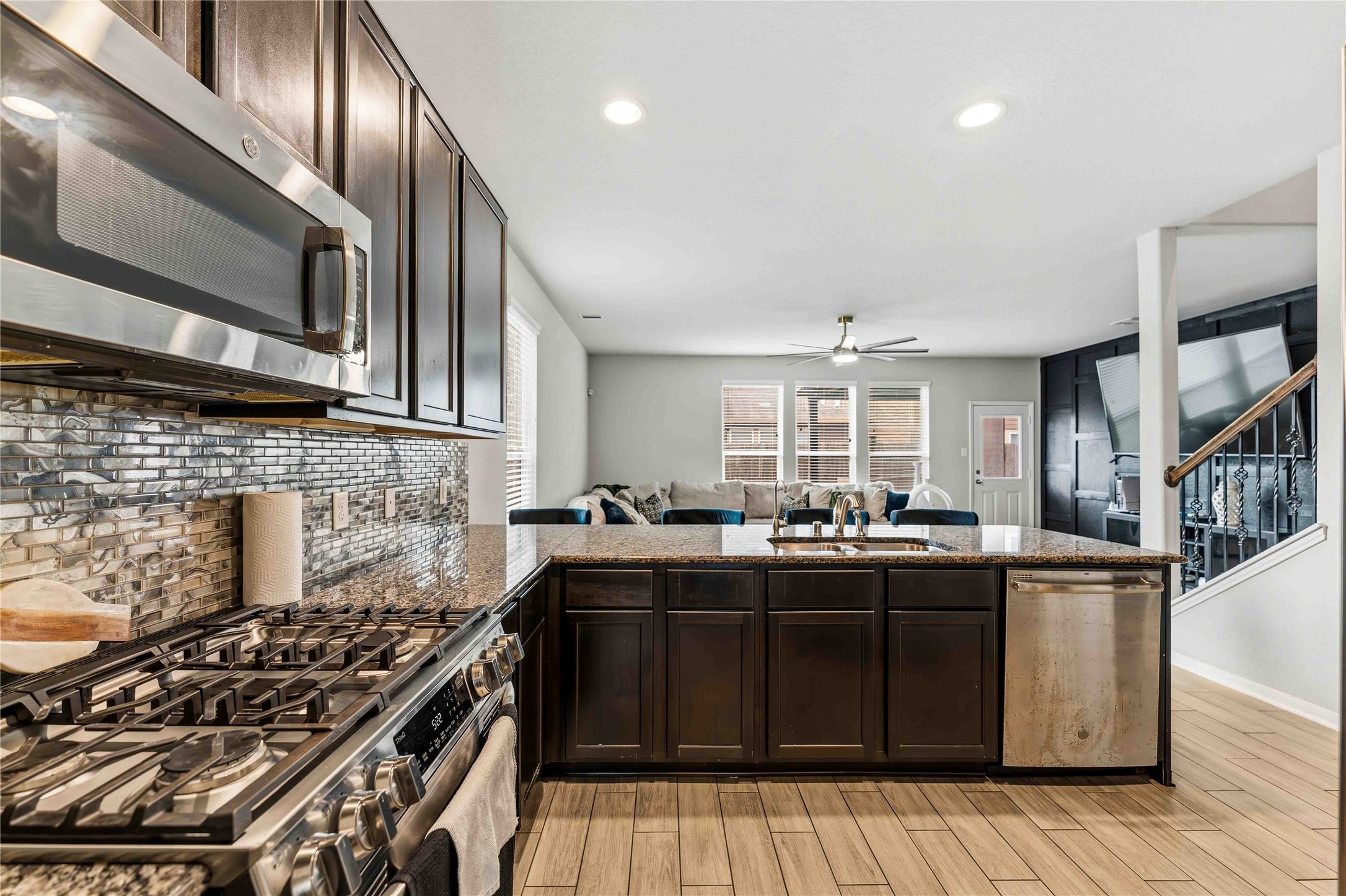 14810 Ruddy Duck Lane Houston, TX 77049 - Photo 8 of 33 a kitchen with stainless steel appliances granite countertop a stove and a sink