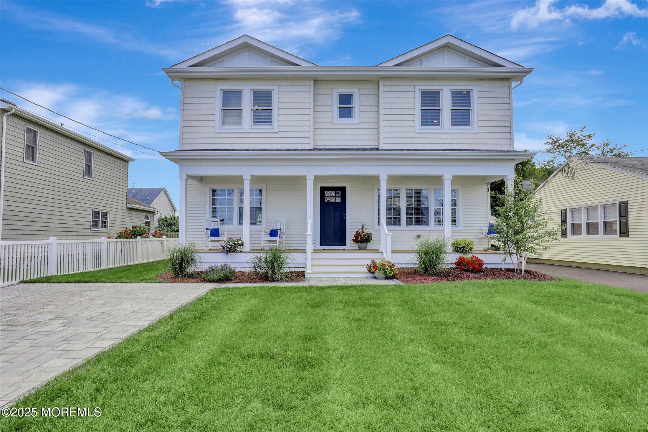 1810 Shore Boulevard Point Pleasant, NJ 08742 - Photo 1 of 49 a front view of a house with a yard and porch