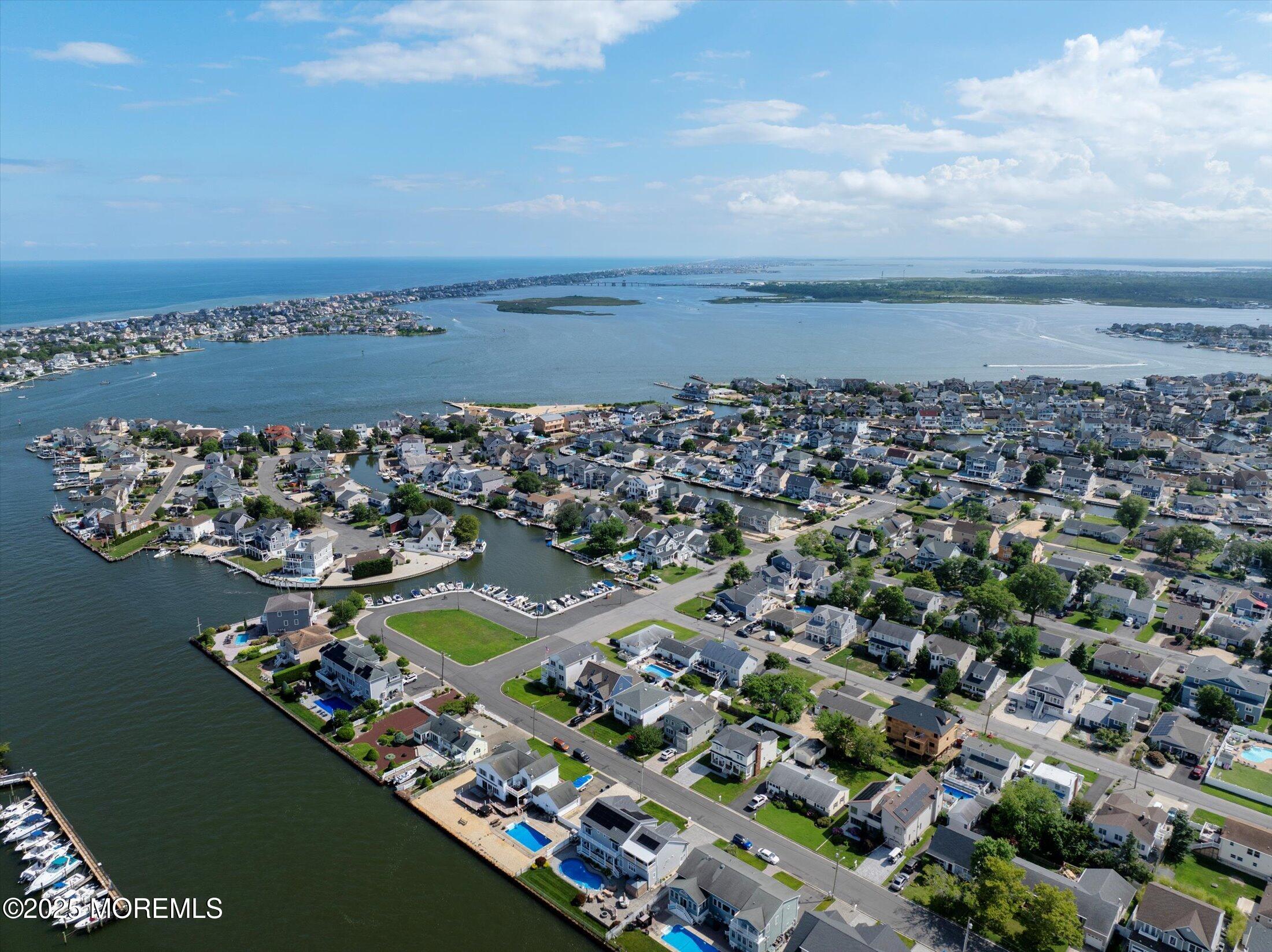 1810 Shore Boulevard Point Pleasant, NJ 08742 - Photo 12 of 49 an aerial view of a city with lots of residential buildings ocean and mountain view in back