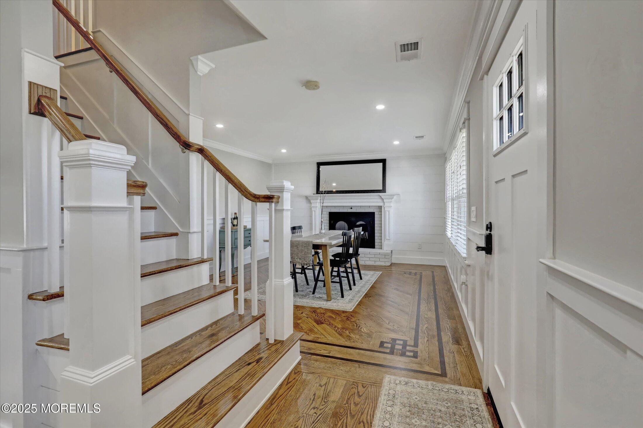 1810 Shore Boulevard Point Pleasant, NJ 08742 - Photo 13 of 49 a view of a hallway with wooden floor and staircase