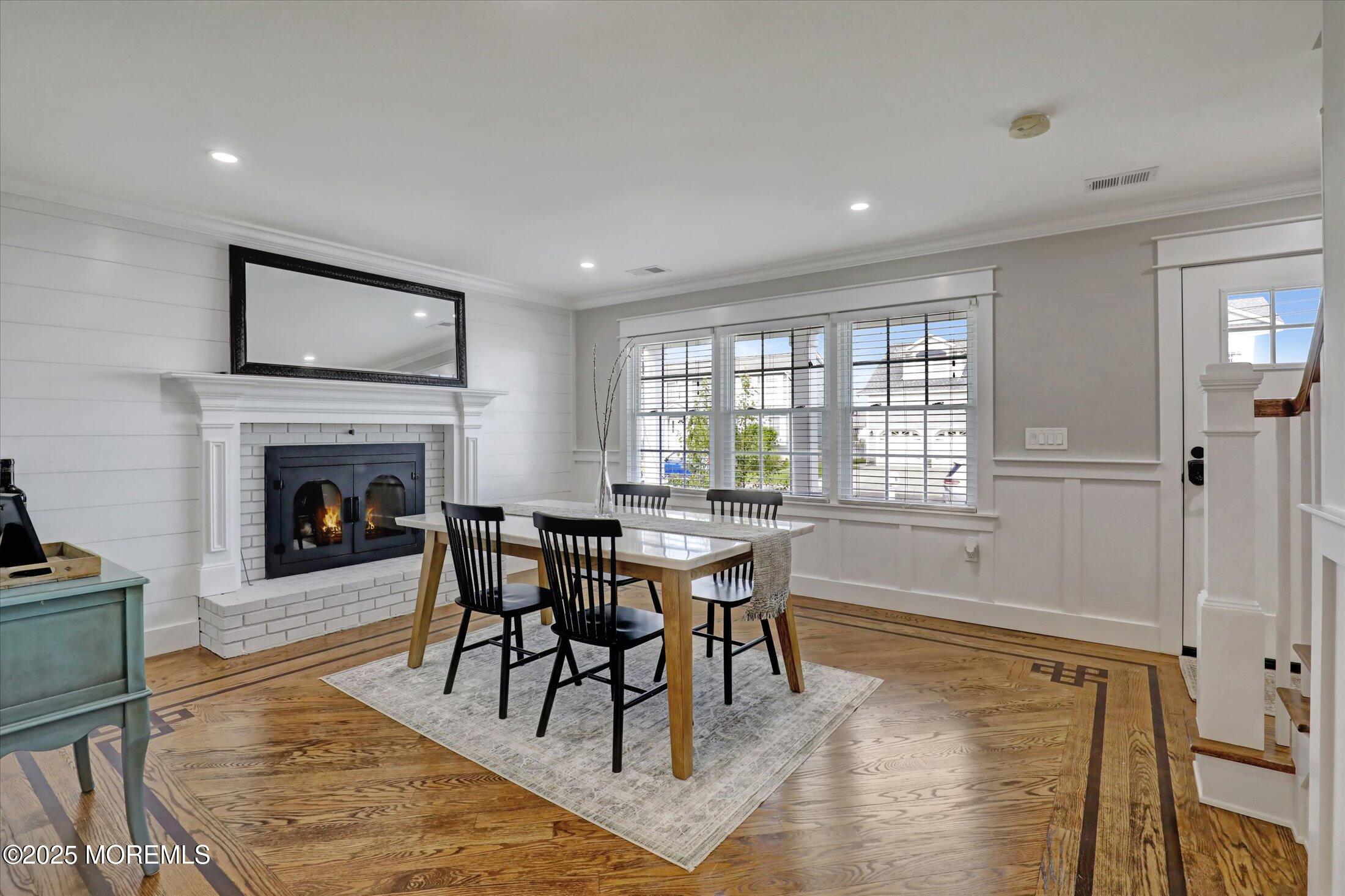 1810 Shore Boulevard Point Pleasant, NJ 08742 - Photo 15 of 49 a dining room with furniture a rug and a fireplace