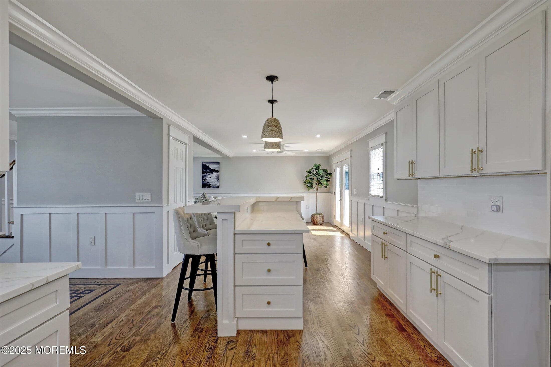 1810 Shore Boulevard Point Pleasant, NJ 08742 - Photo 19 of 49 a kitchen with a wooden floor window and cabinets