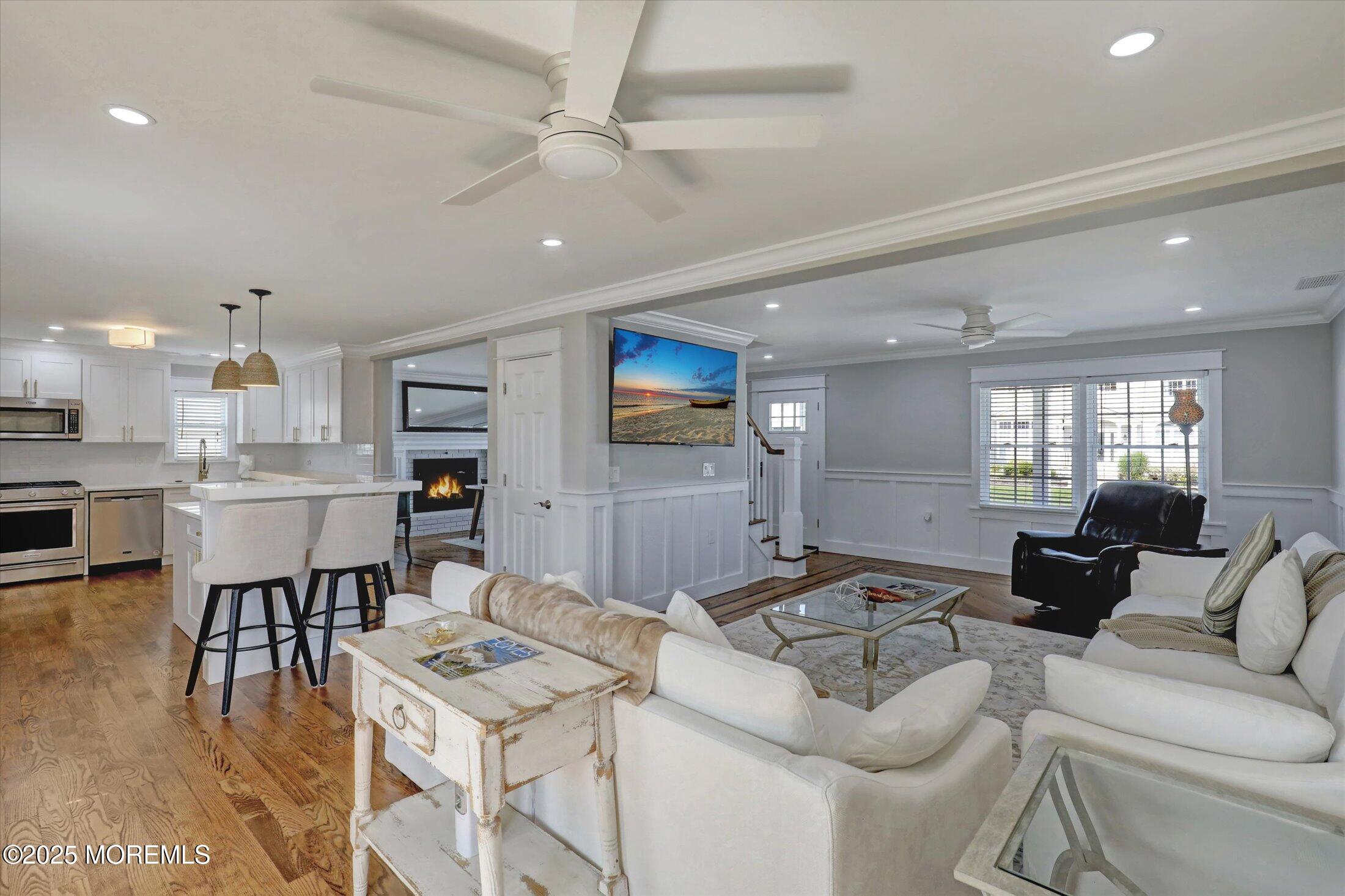 1810 Shore Boulevard Point Pleasant, NJ 08742 - Photo 24 of 49 a living room with furniture kitchen view and a wooden floor