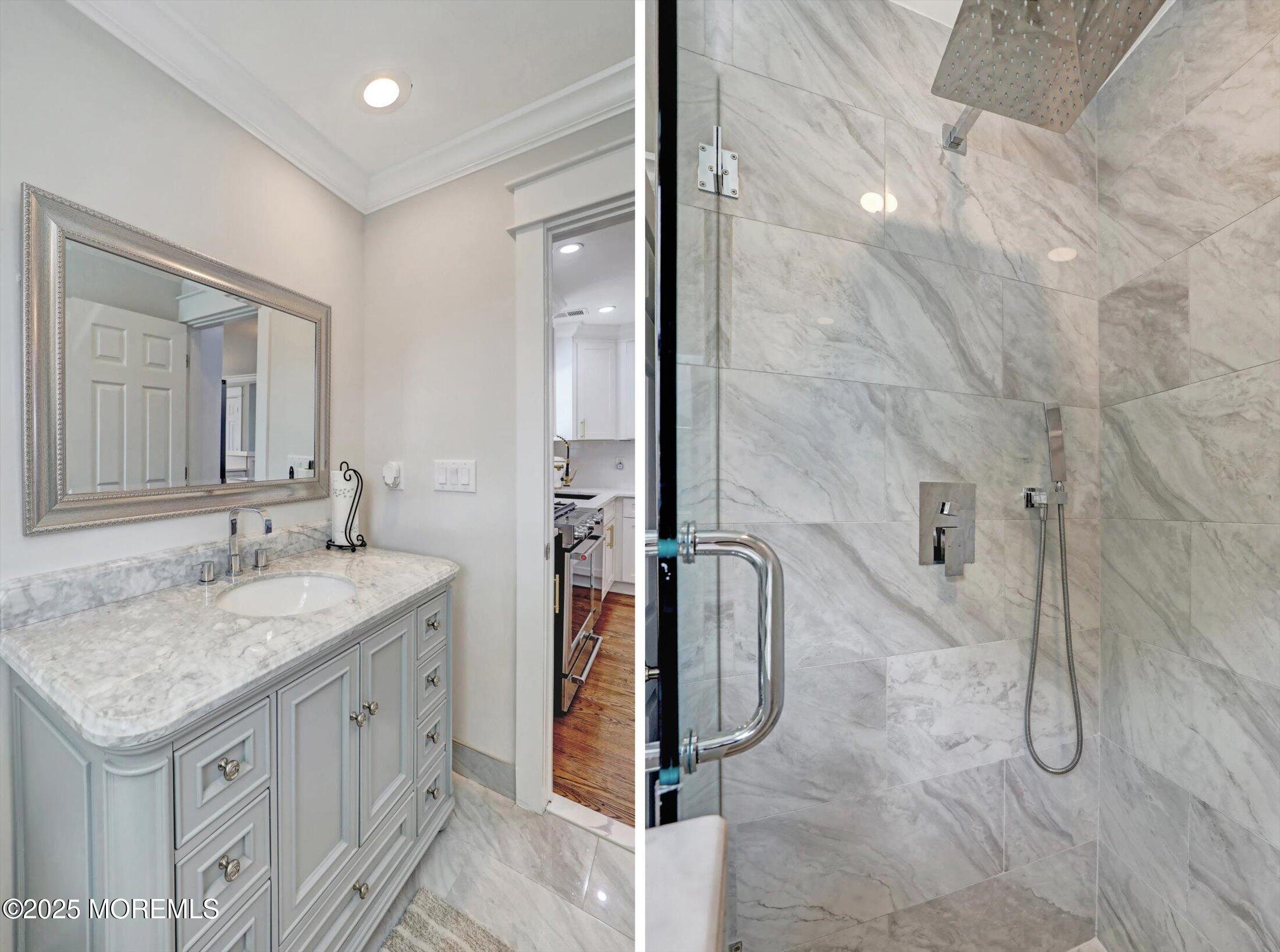 1810 Shore Boulevard Point Pleasant, NJ 08742 - Photo 29 of 49 a bathroom with a granite countertop sink and a mirror