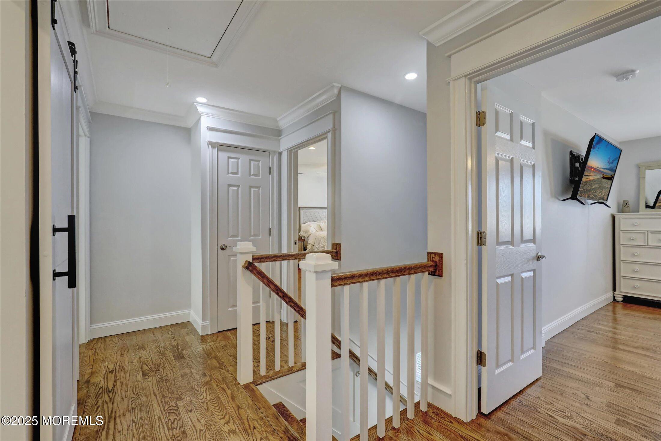 1810 Shore Boulevard Point Pleasant, NJ 08742 - Photo 30 of 49 a view of a hallway with wooden floor and staircase