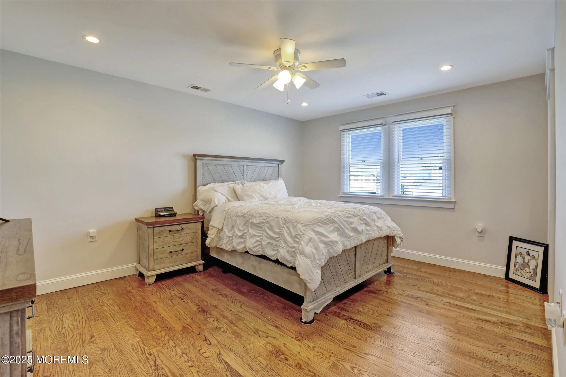 1810 Shore Boulevard Point Pleasant, NJ 08742 - Photo 36 of 49 a bedroom with a bed and window