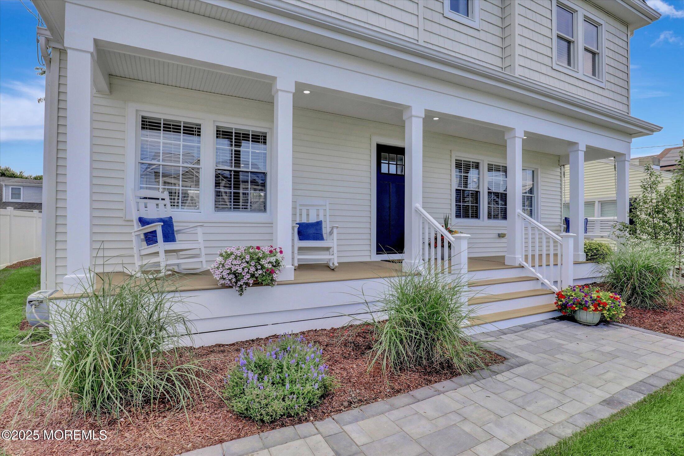 1810 Shore Boulevard Point Pleasant, NJ 08742 - Photo 4 of 49 a front view of a house with garden