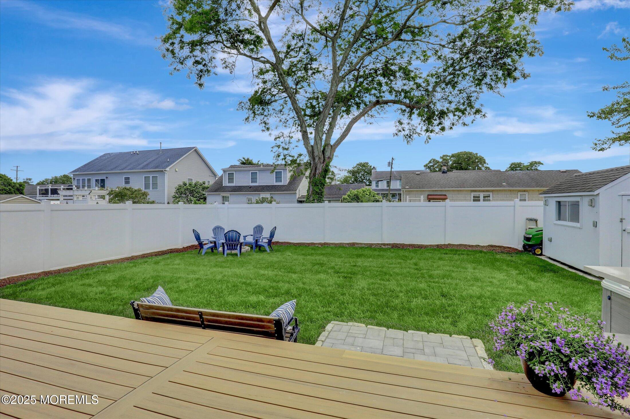 1810 Shore Boulevard Point Pleasant, NJ 08742 - Photo 45 of 49 a view of a backyard with plants and large tree