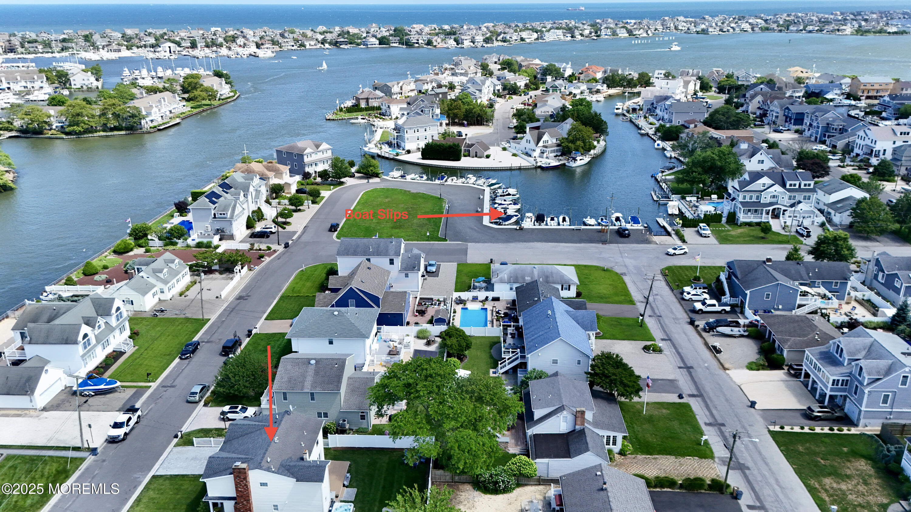 1810 Shore Boulevard Point Pleasant, NJ 08742 - Photo 8 of 49 an aerial view of an swimming pool a yard and mountain view in back