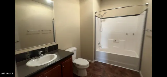 a view of a bathroom from a hallway
